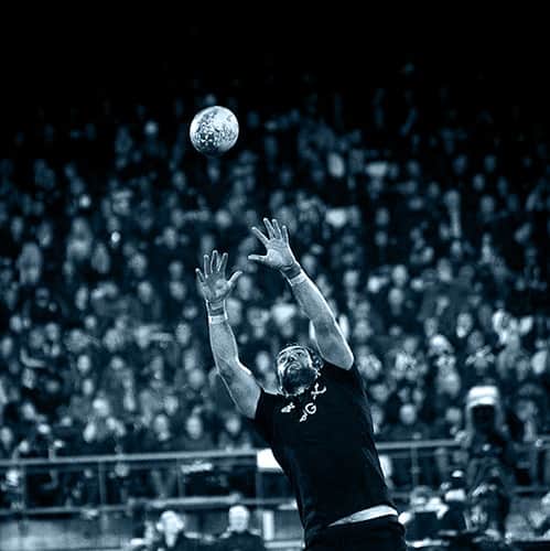 All Blacks player catching rugby ball